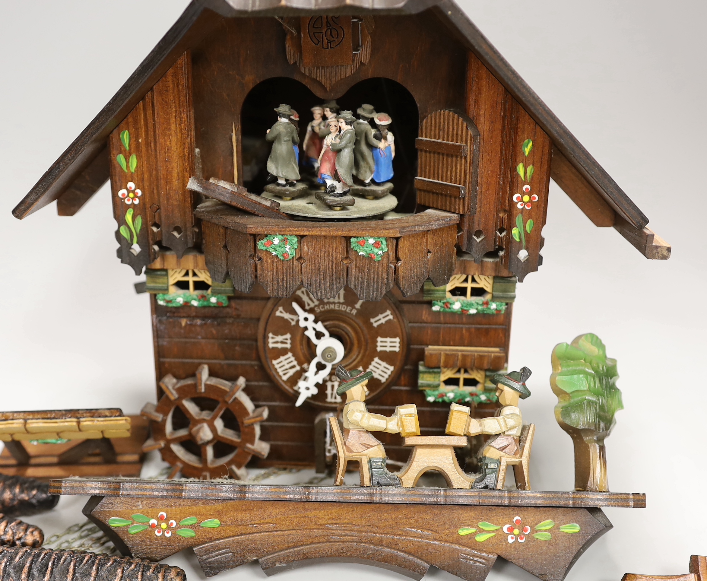 A Schneider German carved wood cuckoo clock